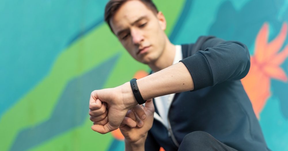 man wearing a fitness bracelet